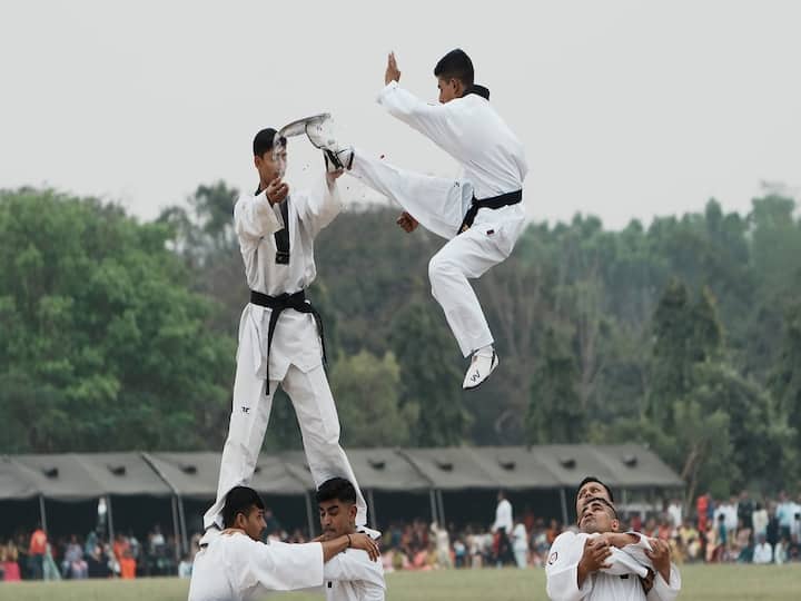 Soldiers of Army Service Corps (ASC) display taekwondo skills. According to defence sources, the national flag and the ASC flag were flying simultaneously on the microlight operated by the army adventure wing, commonly known as 