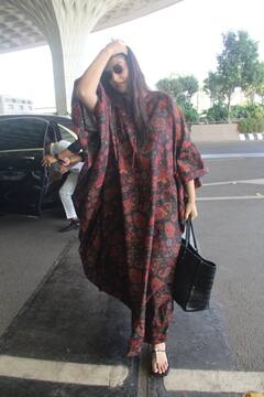 Sonam Kapoor Airport Look: काफ्तान पहनकर एयरपोर्ट पर स्पॉट हुईं सोनम कपूर, वायरल हो रहीं वायु की मम्मी की स्टाइलिश तस्वीरें