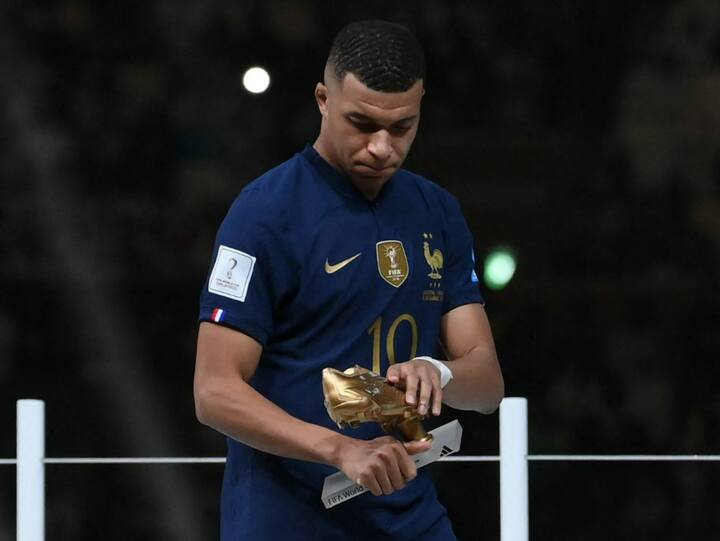 France's forward Kylian Mbappe holds the Golden Boot award during the Qatar 2022 World Cup trophy ceremony after the football final match between Argentina and France at Lusail Stadium in Lusail, north of Doha on December 18, 2022. Argentina won in the penalty shoot-out. (Photo: AFP)