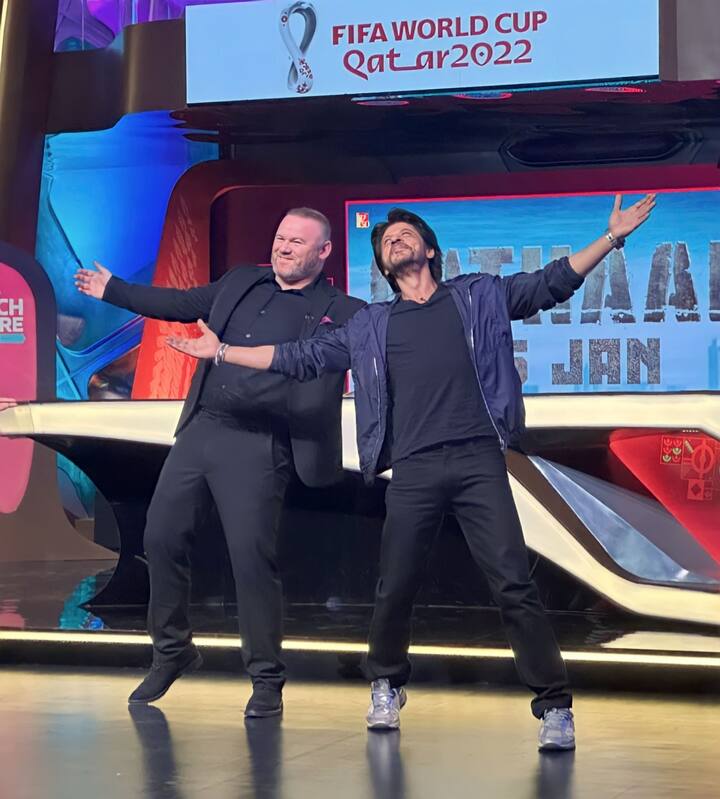 Shah Rukh Khan promoted his film Pathaan ahead of FIFA World Cup 2022 finale match between Argentina and France in Qatar. The actor was joined by former footballer, Wayne Rooney. (Image: Twitter)