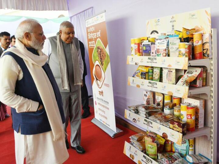 PM Modi and Vice-President Dhankhar check out millet products. The MPs lunch was organised just after Parliament was adjourned when BJP sought apology over the Kharge's remark, 'Has even any dog in your [BJP leaders'] house died for the country?' (Source: Twitter/@narendramodi )