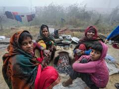 Winter Fog: ऊंची-ऊंची बिल्डिंग के शहर में 6 डिग्री तापमान में बिना छत गुजर-बसर करती जिंदगी की तस्वीरें