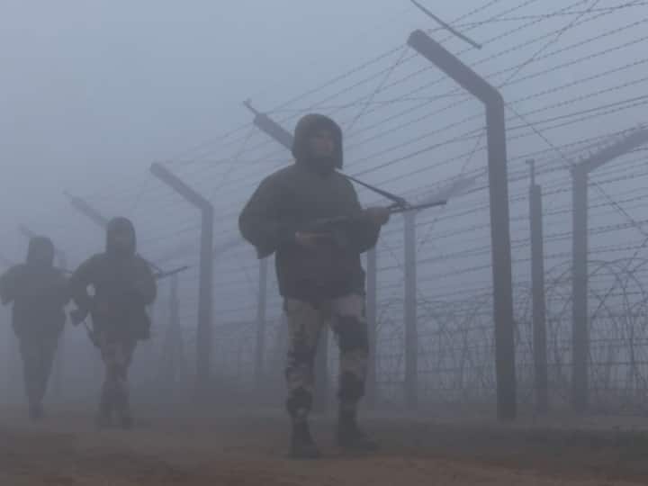 BSF troops wading through a thick blanket of fog and patrolling the India-Pakistan border. (Source: ANI)