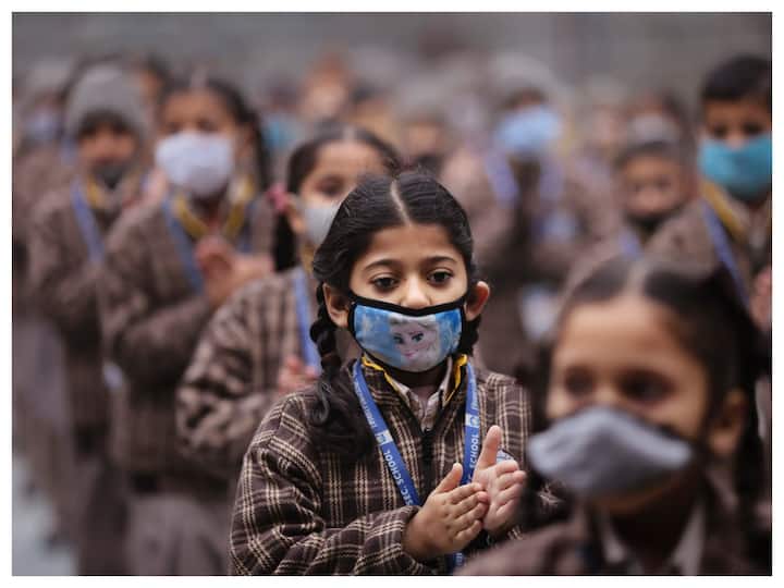 As China grapples with a rise in Covid-19 cases, India is taking all necessary measures to guard itself against the new Omicron variant BF.7, that is driving the surge in the neighbouring country. The image shows school students wearing face masks during morning assembly at their school in Jammu. (Image: PTI)