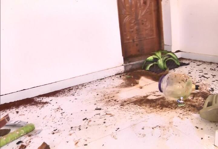 Around 15 men barged into her house and broke glass planes, chairs and flower pots