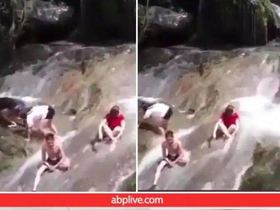 Dozens of people were swept away by the flash flood in the waterfall, a horrifying scene captured on video અચાનક ધોધમાં આવેલા પૂરમાં ડઝનેક લોકો વહી ગયા, Videoમાં કેદ થયું ભયાનક દ્રશ્ય