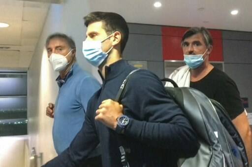 Serbia's Novak Djokovic pictured as he walks ahead of his coach Goran Ivanisevic after they disembarked from their plane at the airport in Dubai on January 17, 2022, after losing a legal battle on January 16 in Australia to stay and play in the Australian Open tennis tournament over his coronavirus vaccination status. Pic Courtesy: AFP