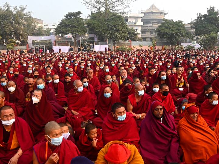 Buddhist monks wearing face masks as a precautionary measure against Covid-19 attend a sermon of Tibetan spiritual leader Dalai Lama at Kalachakra Ground in Bodh Gaya. (Source: PTI)