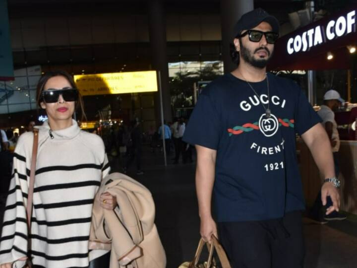 Malaika Arora -Arjun Kapoor Airport Look: बॉलीवुड के लव कपल अर्जुन कपूर और मलाइका अरोड़ा साथ में न्यू ईयर सेलिब्रेट कर मुंबई वापस लौट आए हैं. हाल ही में दोनों को एक साथ एयरपोर्ट पर स्पॉट किया गया है.