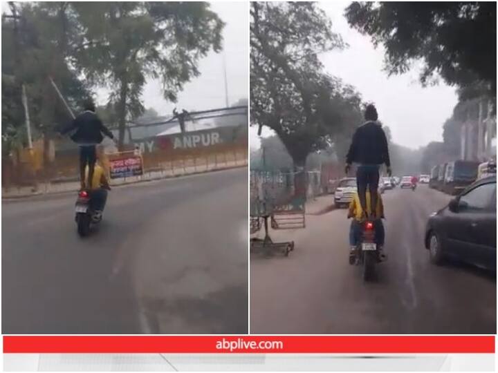 Video: कड़ाके की ठंड के बीच बाइक पर युवकों ने किया स्टंट, यूजर्स ने उठाए सवाल Man performs stunt on busy road near Motijheel in Kanpur Video: कड़ाके की ठंड के बीच बाइक पर युवकों ने किया स्टंट, यूजर्स ने उठाए सवाल