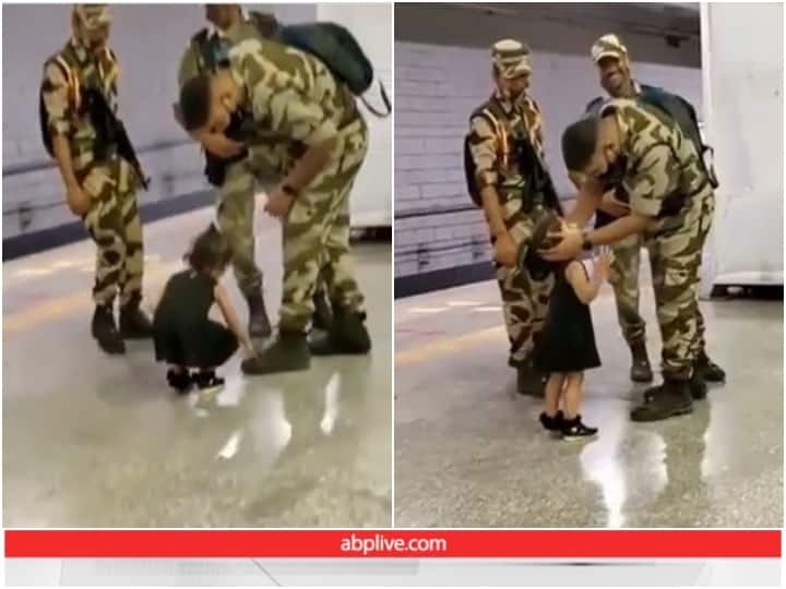 little girl touching feet of an army man at a metro station viral video Viral Video: मेट्रो स्टेशन पर छोटी बच्ची ने छुए जवान के पैर, दिल जीत लेगा वीडियो