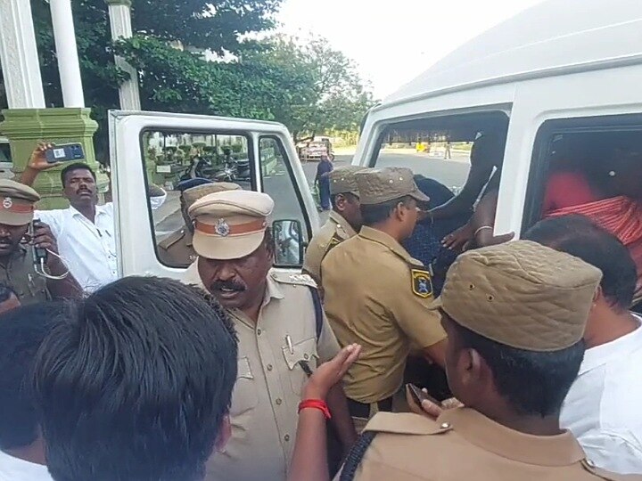 கரூர்: கணவர் மீது பொய் வழக்கு;  மாவட்ட ஆட்சியர் அலுவலகம் முன்பு மனைவி தர்ணா