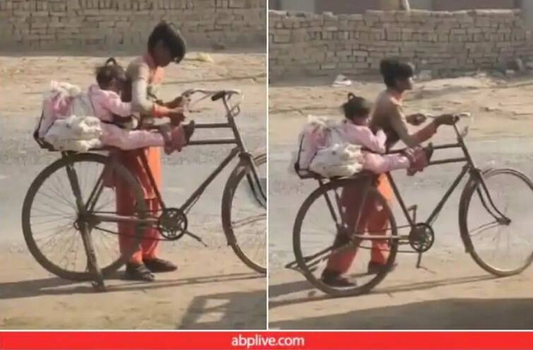 Brother's unique trick to save younger sister from falling from bicycle, will appreciate watching video ਛੋਟੀ ਭੈਣ ਨੂੰ ਸਾਈਕਲ ਤੋਂ ਡਿੱਗਣ ਤੋਂ ਬਚਾਉਣ ਲਈ ਭਰਾ ਦਾ ਅਨੋਖਾ ਜੁਗਾੜ, ਵੀਡੀਓ ਦੇਖ ਕੇ ਉੱਡ ਜਾਣਗੇ ਹੋਸ਼