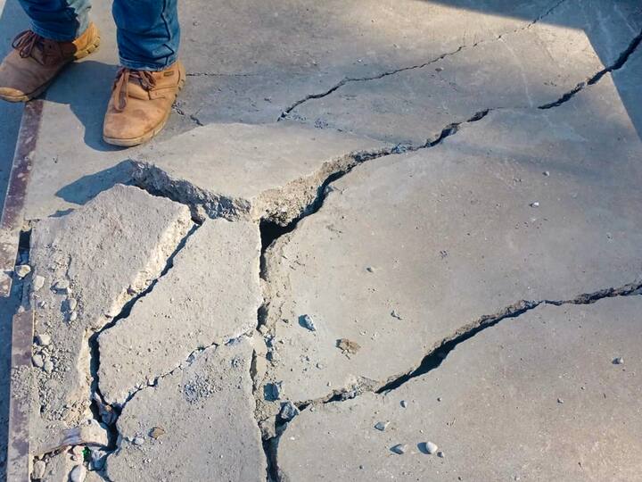 A man stands near cracks at his house in Joshimath in Chamoli district of Uttarakhand. (Source: PTI)