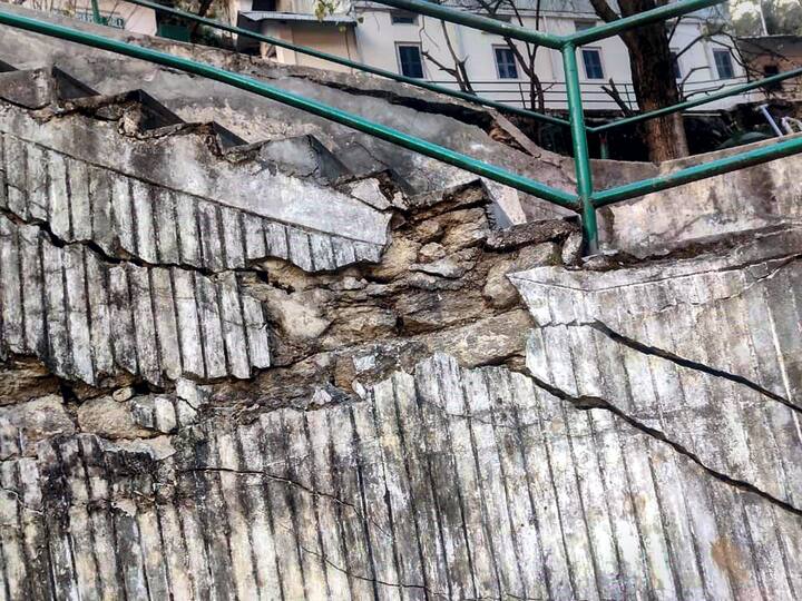 The hilly roads which were built for commute had major cracks formed this morning. People were afraid to walk on these. (Image Source: PTI)