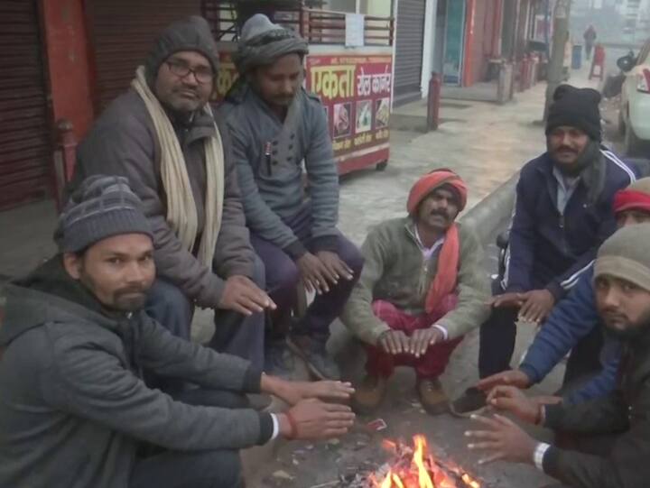 People light up bonfires to find respite from the prevailing cold wave and fog conditions in Gorakhpur city. (Photo: Twitter/ANI)