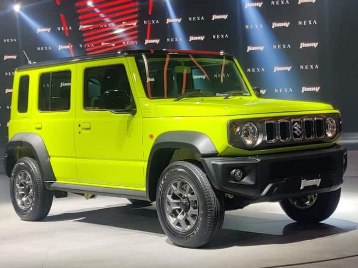 The Jimny 5-door comes with a healthy amount of cladding and gets usual Maruti design for steering wheel but switchgear has round chunky knobs like on the Swift. Feature list is also well-packed.