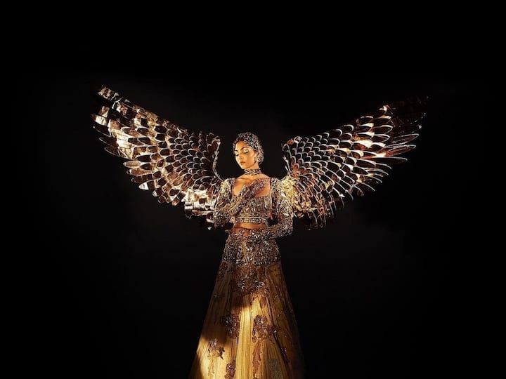 Divita Rai, India's Miss Universe candidate, transformed herself into a breathtaking 'Sone Ki Chidiya' by wearing a magnificent golden lehenga with wings. (Image Source: Twitter/@MissDivaOrg)