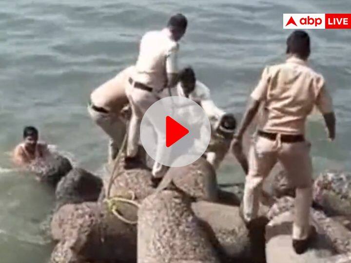 Mumbai Marine drive police save drowning man watch rescue video Watch: डूबते शख्स को मुंबई पुलिस का सहारा! मरीन ड्राइव पर गहरे पानी से निकालकर यूं बचाई जान, देखें वीडियो