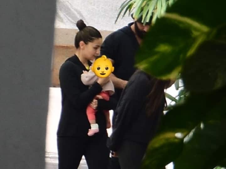 For the first time, Alia Bhatt and Ranbir Kapoor were sighted on Friday outside of what appeared to be their Mumbai apartment building with their newborn daughter Raha Kapoor. (Image Source: Manav Manglani)