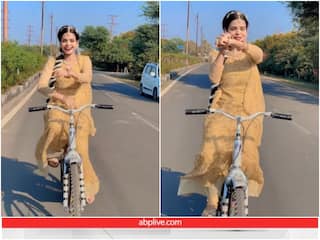 Viral Video: साइकिल चलाते हुए युवती ने किया डांस, बैलेंस देख यूजर्स हो रहे हैरान
