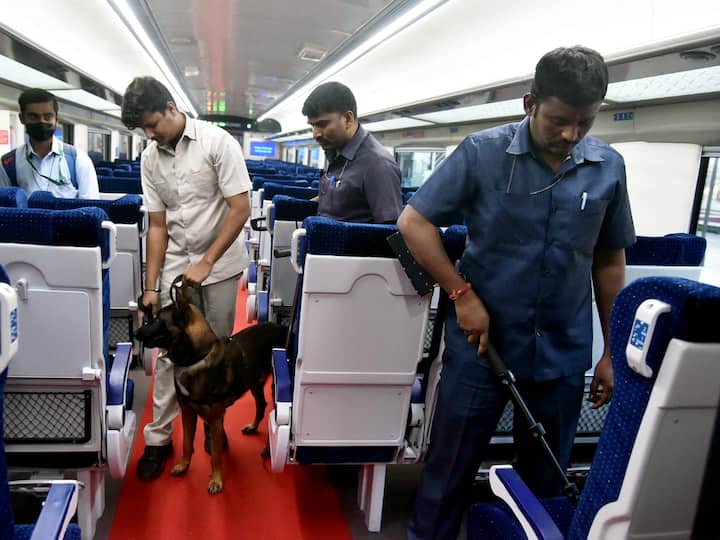 Security personnel with a sniffer dog check a coach of Vande Bharat Express train connecting Secunderabad and Visakhapatnam before its flagging off ceremony, in Secunderabad. (Source: PTI)