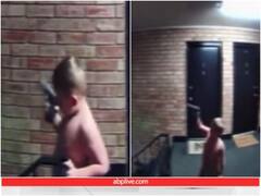 डायपर पहने बच्चे ने हवा में लहराई पिस्टल, पिता को हो गई जेल... ये रहा वीडियो