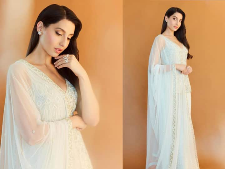 Nora looked stunning in a white sleeveless short Kurti with beautiful embroidery work and a white skirt with the same pattern along with a white stain dupatta.