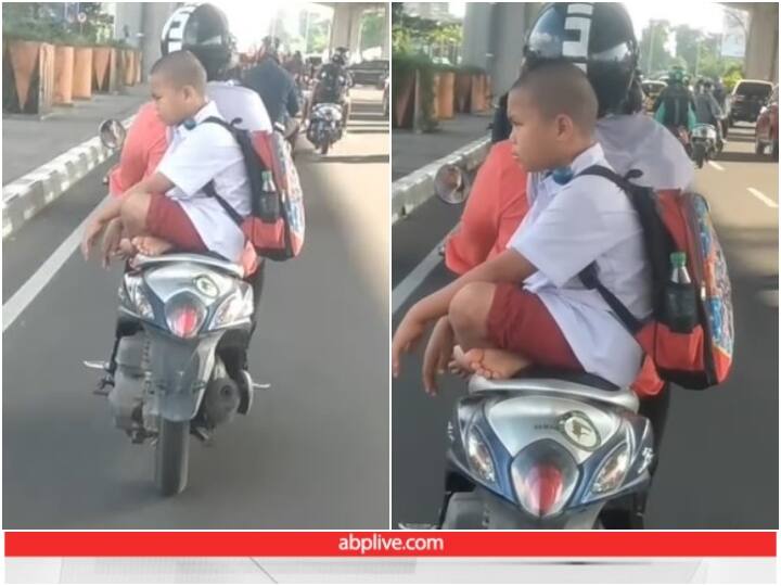 School going child seen sitting angrily on back seat of scooty Viral Video: बेटे को स्कूटी से स्कूल ले जाती नजर आई मां, बच्चे के स्टाइल ने जीता दिल