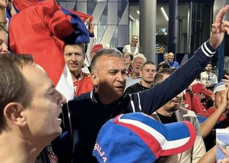 Australian Open 2023: Controversy Erupts As Novak Djokovic's Father Seen With Man Holding Putin Flag Australian Open 2023: Controversy Erupts As Novak Djokovic's Father Seen With Man Holding Putin Flag