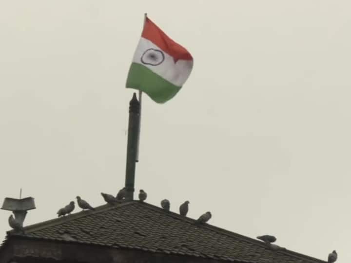 The Tricolour flies high atop the clock tower at Lal Chowk in Srinagar, on Republic Day. (Photo: Twitter/ANI)