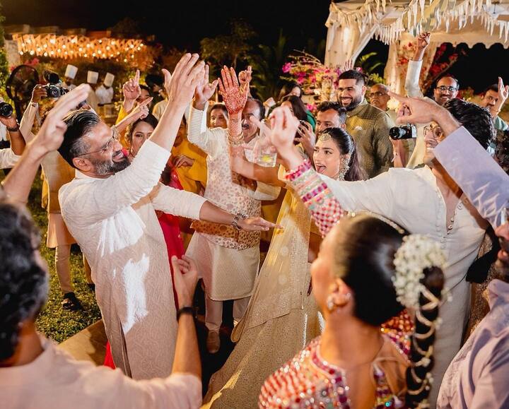 The pictures are proof that the wedding festivities were all about fun and frolic as father Suniel Shetty shook a leg with others on Sangeet night.