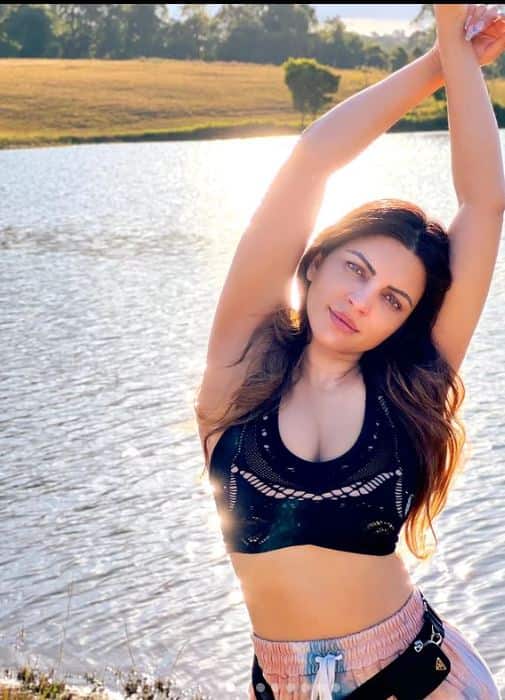 Channeling her inner diva, Shama in a black bikini top with printed jeggings