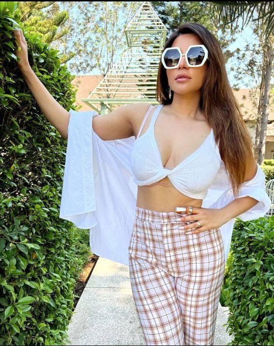 Shama in all things casual and hot; a white bikini top with check bottoms