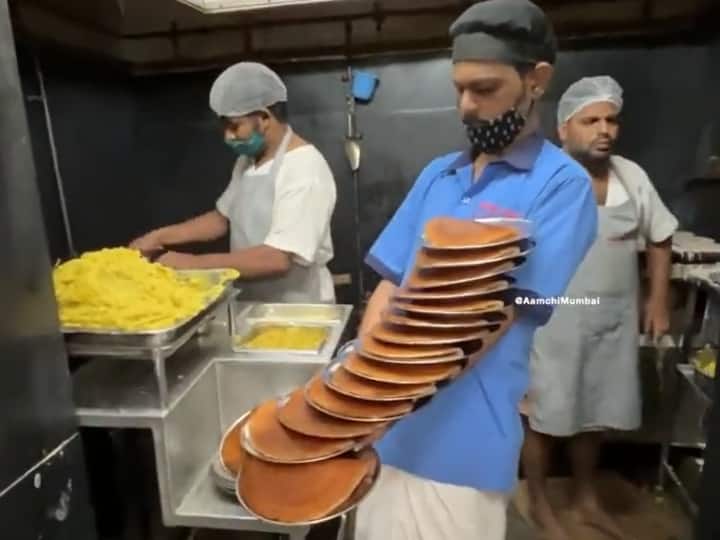 The waiter was serving by keeping 16 plates of dosa together in his hands, everyone is going crazy about this balance
