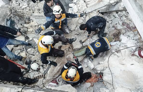 Rescue personnel and neighbours combed through tangles of metal and shards of concrete to look for survivors under the debris of their homes in numerous places. (Source: Getty)