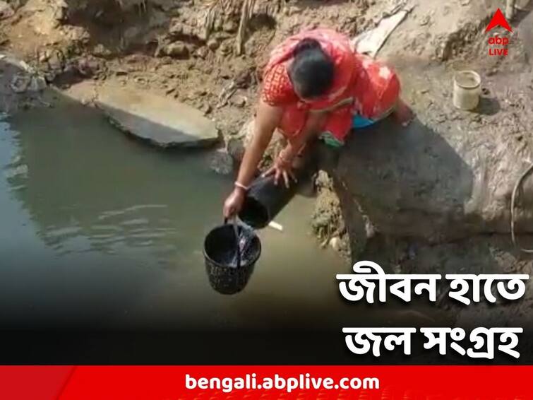 Water for drinking and domestic purposes has to be collected from the pipe adjacent to the 10 feet low canal Water Crisis: টিউবওয়েল থাকলেও তা অকোজো, প্রাণের ঝুঁকি নিয়ে জল সংগ্রহ পূর্ব বর্ধমানে