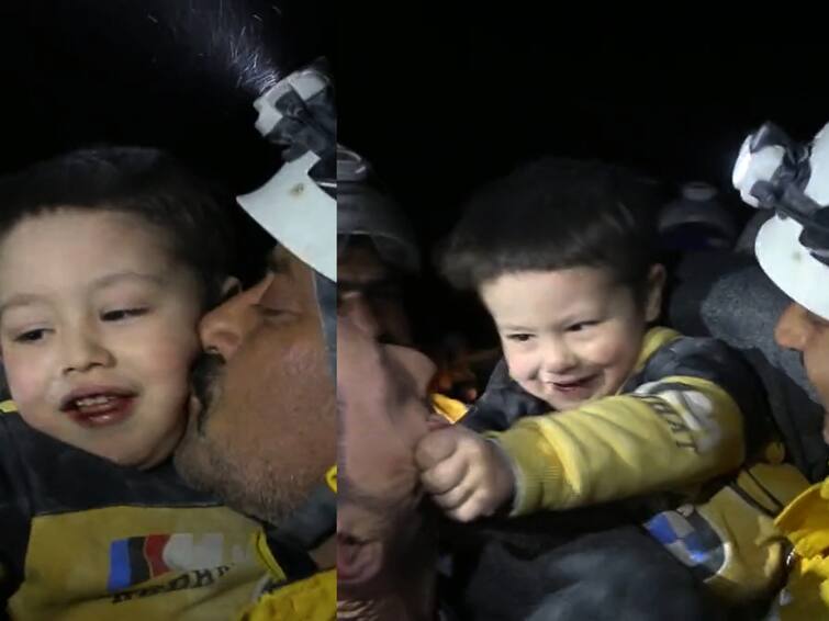 watch video rescued child embrace and smile at rescue workers at Idlib Armanaz Syria இடிபாடுகளுக்கு இடையே தோன்றிய நம்பிக்கை ஒளி...! மீட்புப் பணியாளர்களுடன் கொஞ்சி விளையாடிய குழந்தை! உணர்வுப்பூர்வமான வீடியோ!