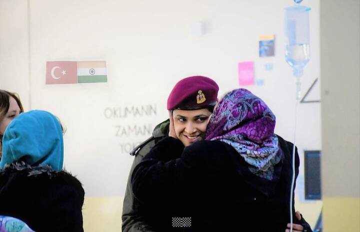 A Turkish woman hugs a woman officer of the Indian Army and gives her a peck, in an earthquake-affected area of Turkey.(Source: ANI)