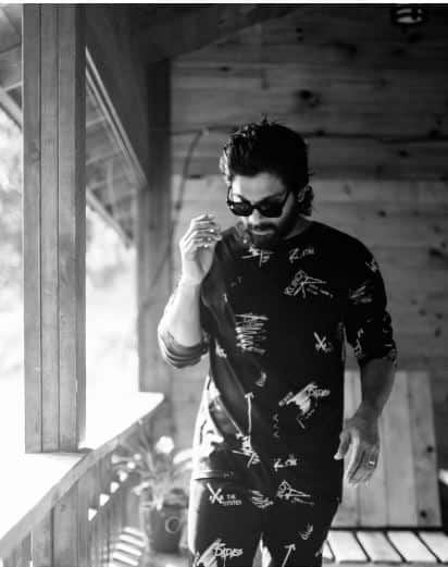 Wearing a black hoody with his signature black shades on wet hair, Allu Arjun's super cool look is truly a vision to behold.