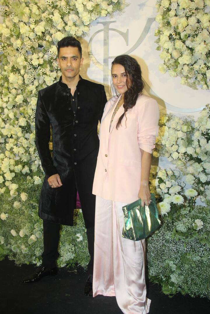 The theme for the lavish reception party was black and bling. Neha Dhupia arrived with husband Angad Bedi. While the actress opted for a  pastel dress paired with a matching blazer, Angad looked dapper in a black velvet sherwani.