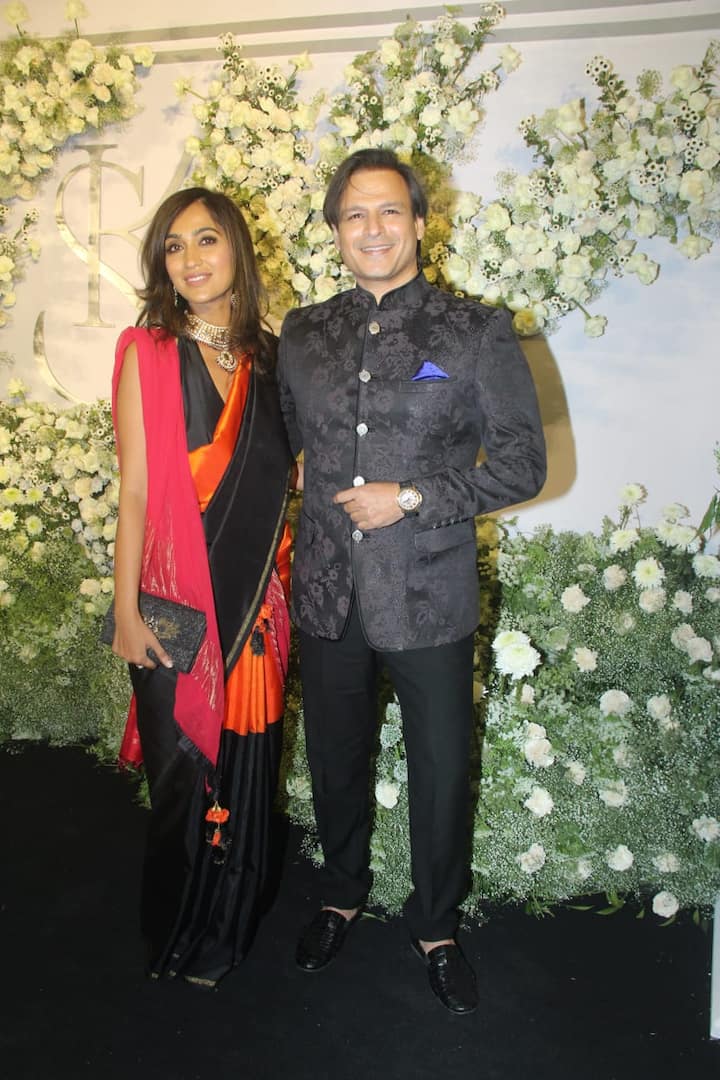 Vivek Oberoi opted for a printed black bandhgala while his wife Priyanka went ahead with a multi-coloured saree and a statement necklace.