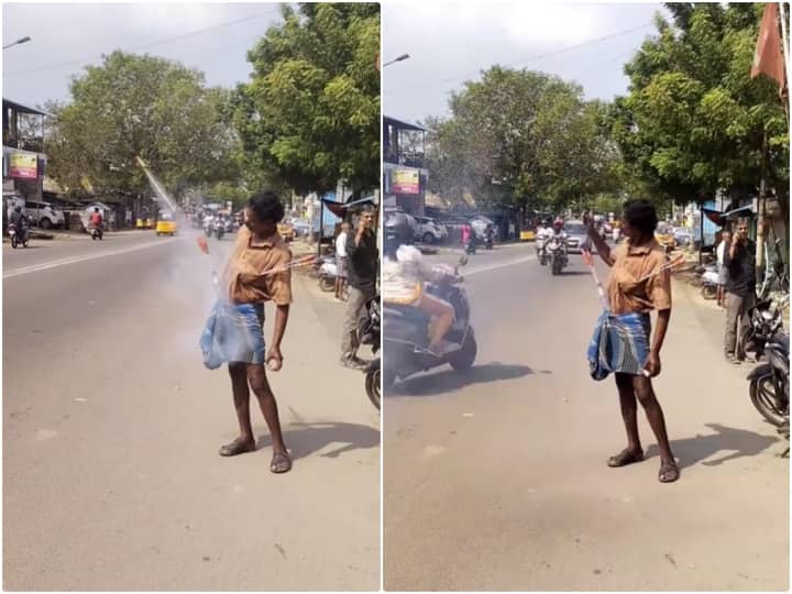 Video: शख्स ने लुंगी में फंसा कर चलाए खतरनाक रॉकेट, वीडियो देख उड़ जाएंगे होश man is seen operating rocket by trapping it inside his lungi Video: शख्स ने लुंगी में फंसा कर चलाए खतरनाक रॉकेट, वीडियो देख उड़ जाएंगे होश