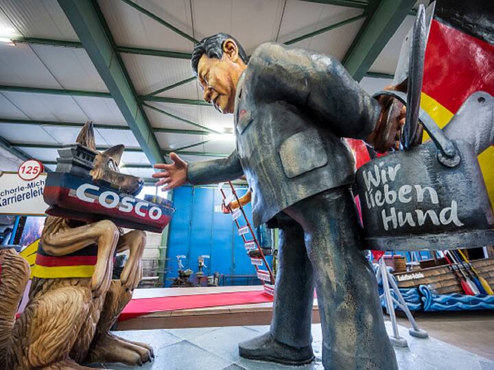 A float depicting Chinese President Xi Jinping and a German Shepherd dog stands in the carriage hall of the Carneval-Verein 1838 e.V. carnival club ahead of the Rose Monday procession in Mainz, Germany.  (Image Source: Getty)