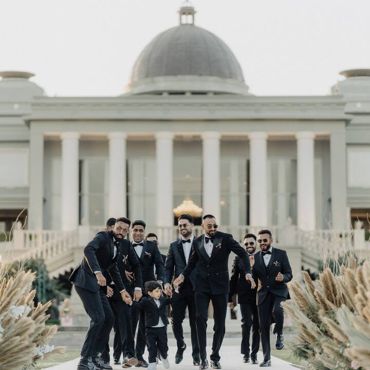 One of the photos show Hardik walking to the wedding venue with his best man and groomsmen including son Agastya and brother Krunal.