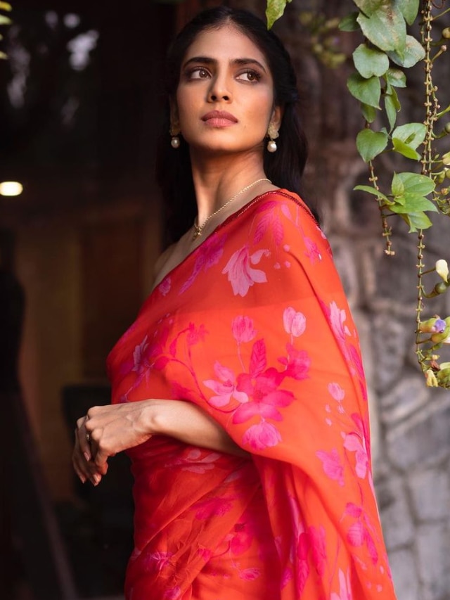 Beauty Overloaded: Malavika Mohanan In An Orange Printed Saree