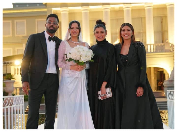 Indian cricketer Hardik Pandya and Natasa Stankovic renewed their vows on Tuesday, in Udaipur with close family and friends. They also shared pictures from their white wedding.