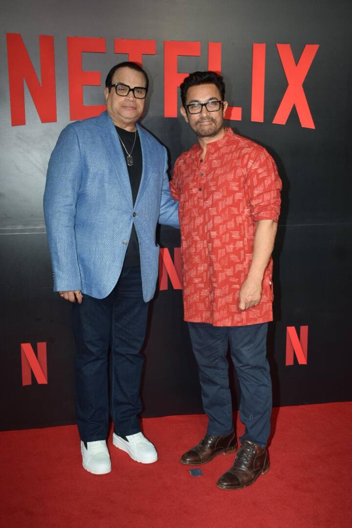 At a Netflix event, Aamir Khan shook hands with a photographer and posed for photos alongside filmmakers Ramesh Taurani, Hansal Mehta and Karan Johar.