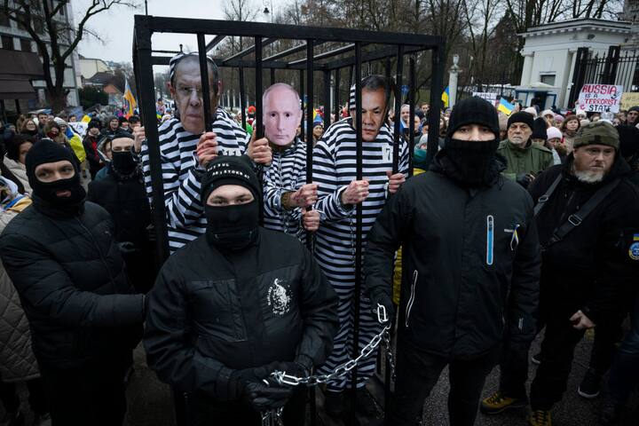 The war also saw several protests in Russia and Ukraine against the Russian invasion. Here is one such protest with agitators demanding a trial against 'war criminals'. Hence a demonstration with people as prison guards and people with masks of Russian President Vladimir Putin, Russian minister of defence Serge Shoigu, Russian minister of foreign Affaris Sergey Lavrov and Belarusian president Aleksander Lukashenko inside the prison. (Image Credit: Getty Images)