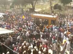 Supporters Of 'Waris Punjab De' Chief Break Through Police Barricades Brandishing Guns — WATCH